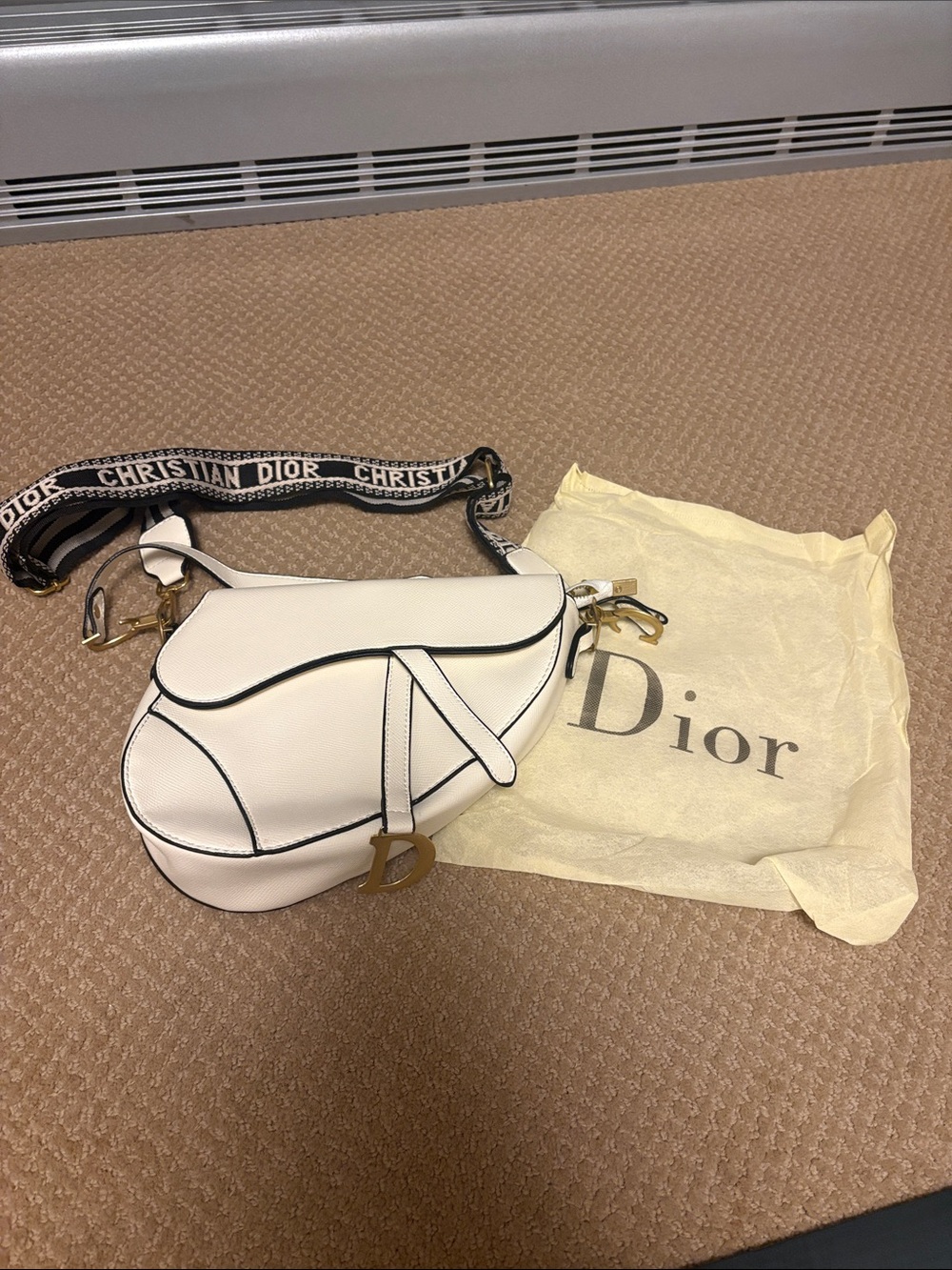 Inspired Cream Saddle Bag with Black Piping and Logo Charm
